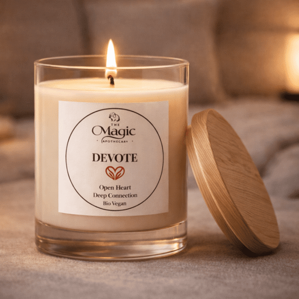 Devote, aromatherapy candle, lit candle, wooden lid resting beside, for love and connection, The Magic Apothecary