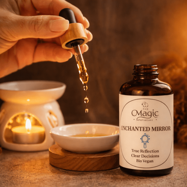 Enchanted Mirror of Truth, mezcla de aceites esenciales para autorreflexión honesta, pipeta y gota de aceite, primer plano, The Magic Apothecary