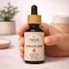 Stillflame, miscela di oli essenziali per calma e meditazione, mano con contagocce, luce calda editoriale, The Magic Apothecary