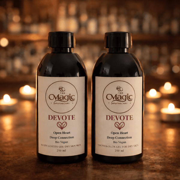 Devote shower gel and body lotion bottles on a table with warm candlelight in the background